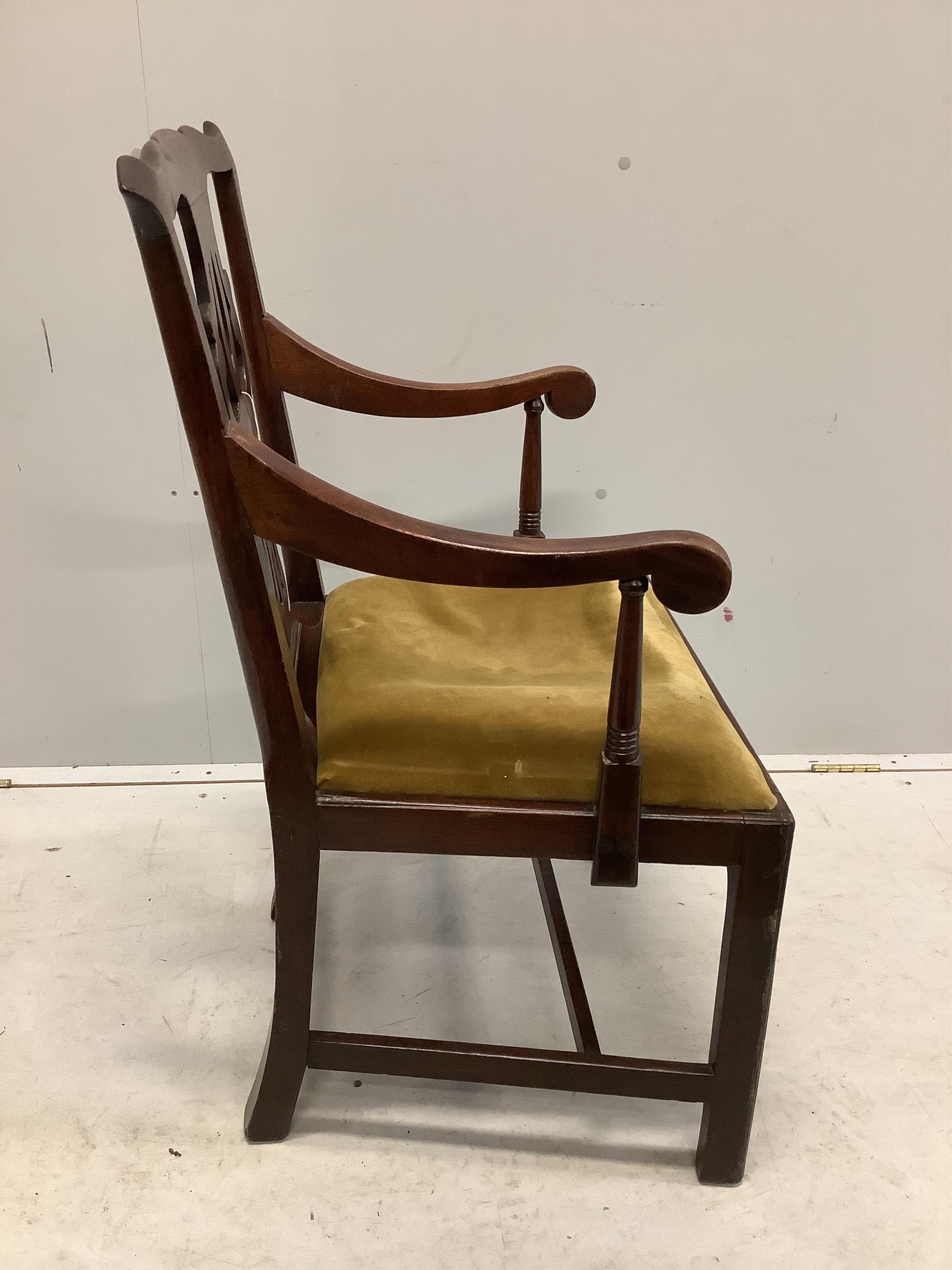 A George III Chippendale style mahogany elbow chair with a later similar elbow chair. Condition - fair